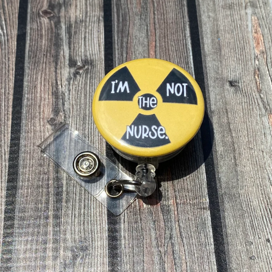 Badge Reel I'm Not the Nurse Radiation Symbol